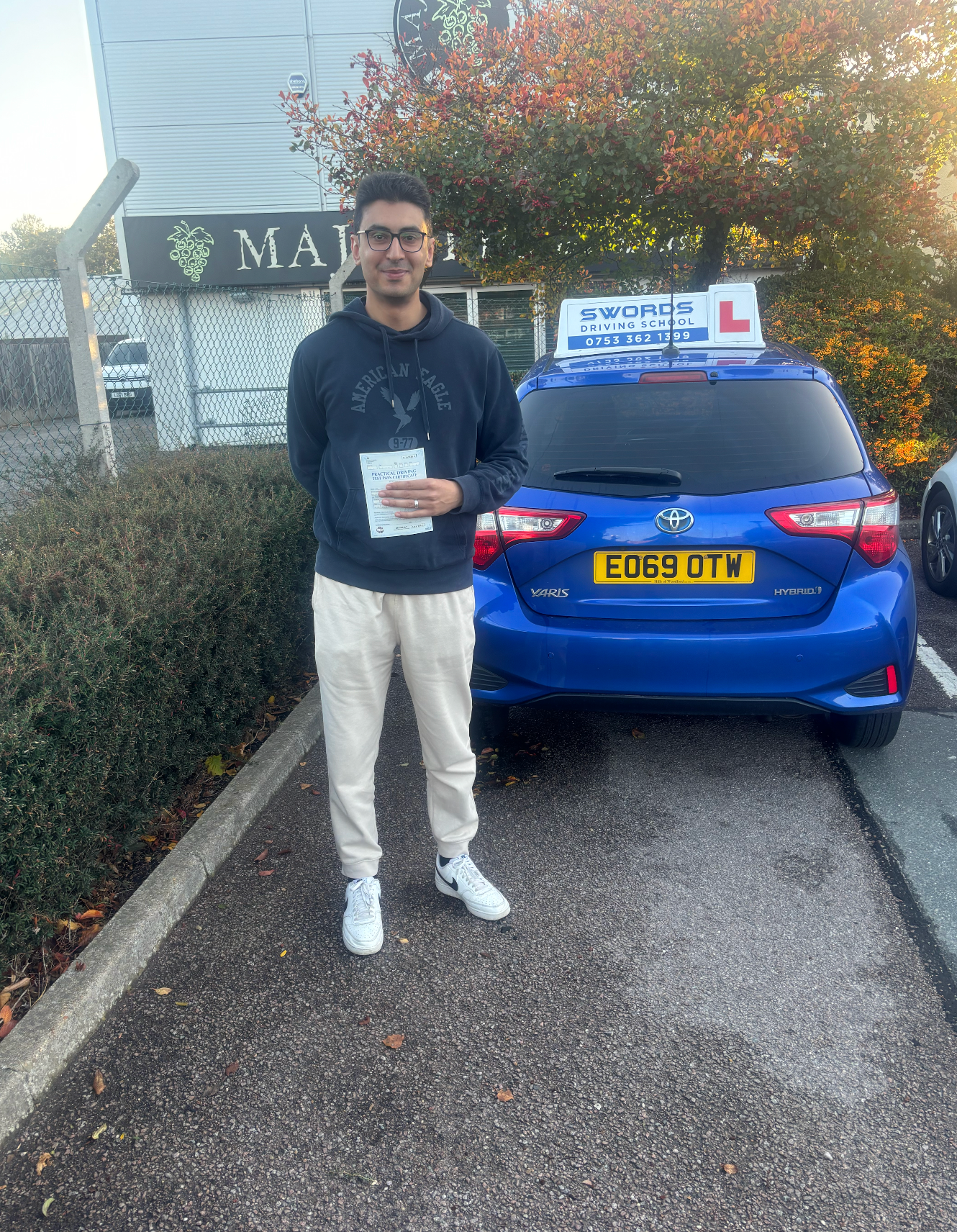 Student celebrating a driving test pass